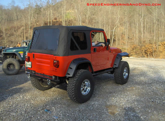 American Racing wheels a 3" body lift and bushwhacker fender flares have Williams TJ looking good 